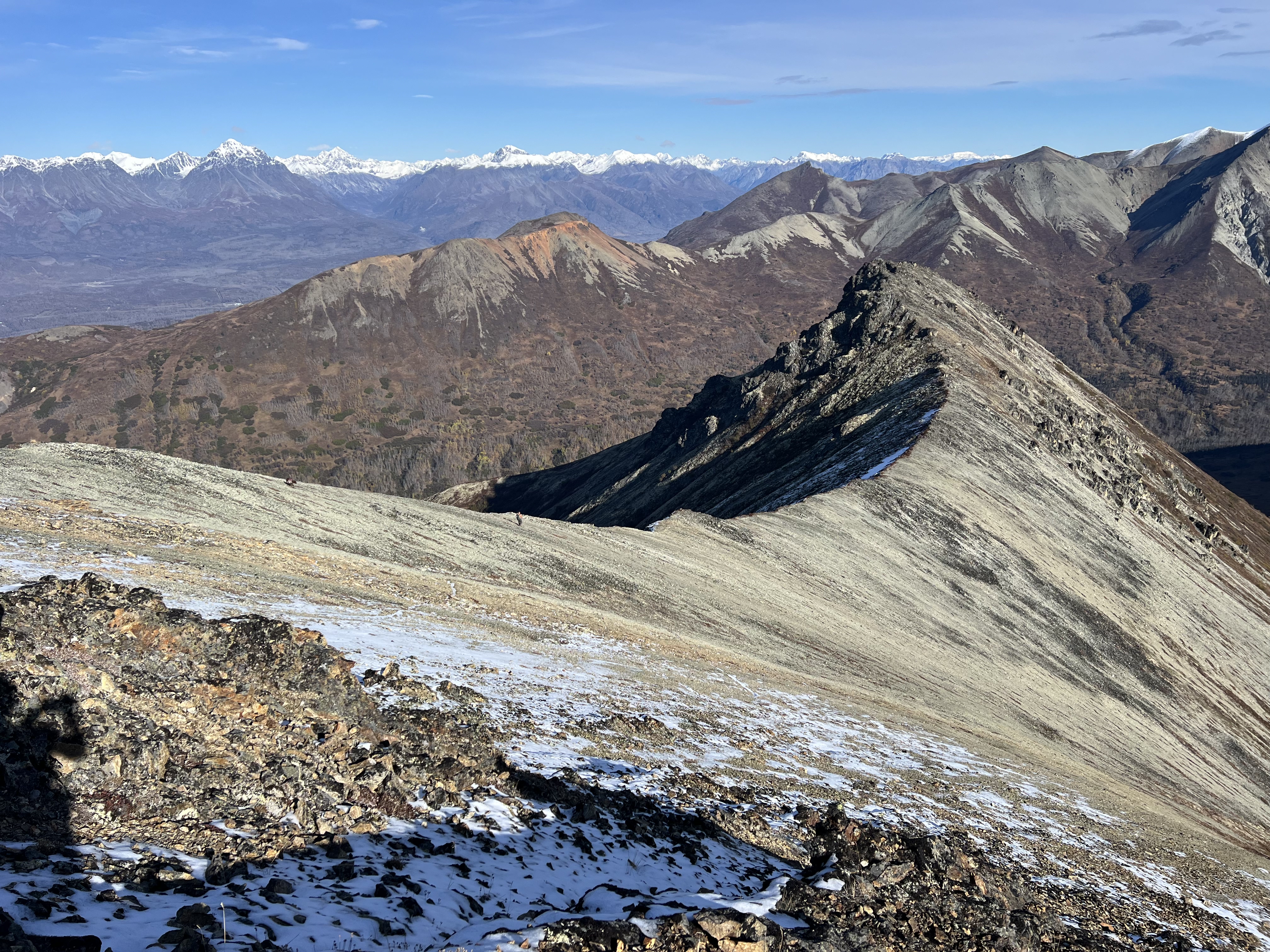 Northeast Ridge heading out to a point with mountain ranges beyond.
