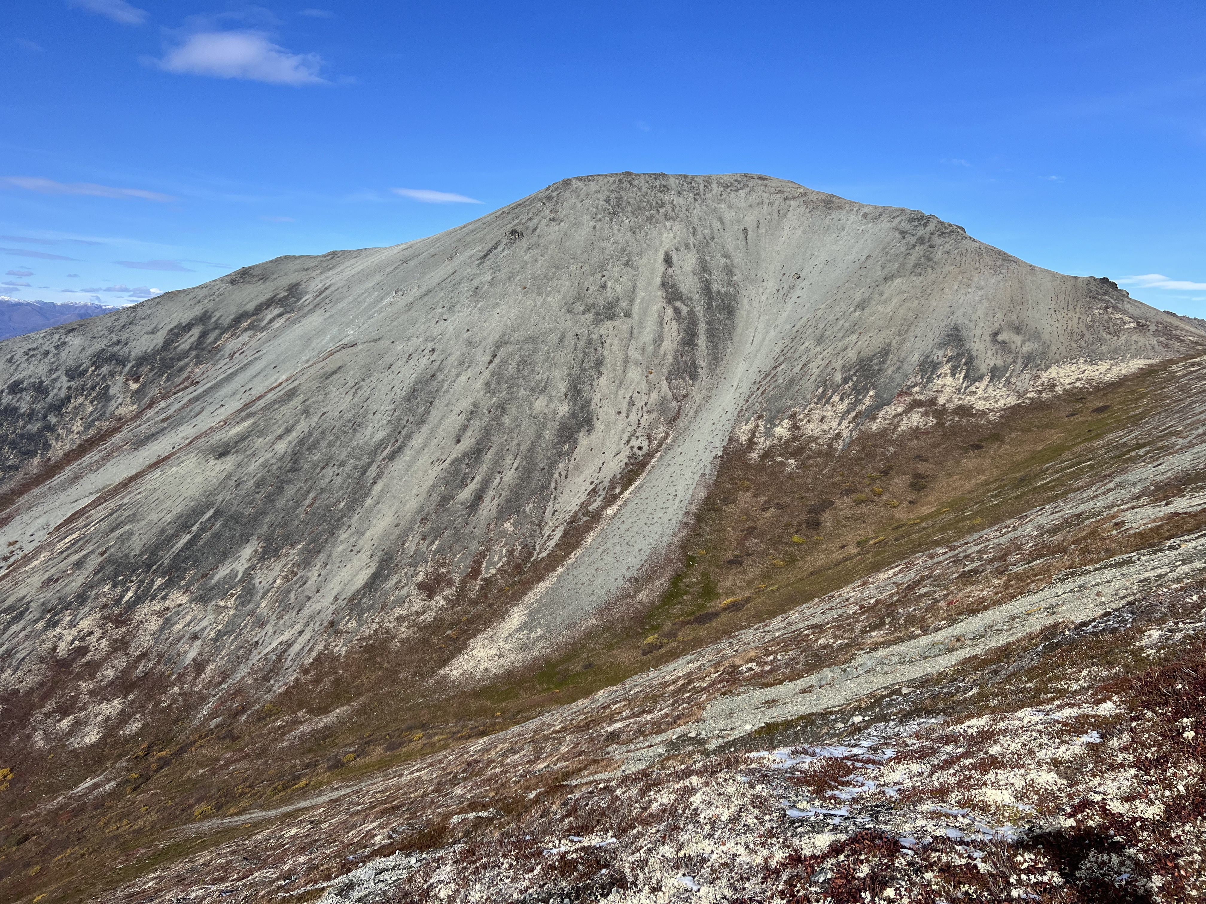 Peak 4199. A big, gray, vegetation free peak. Evidence of a long, smooth landslide coming down from the ridge
