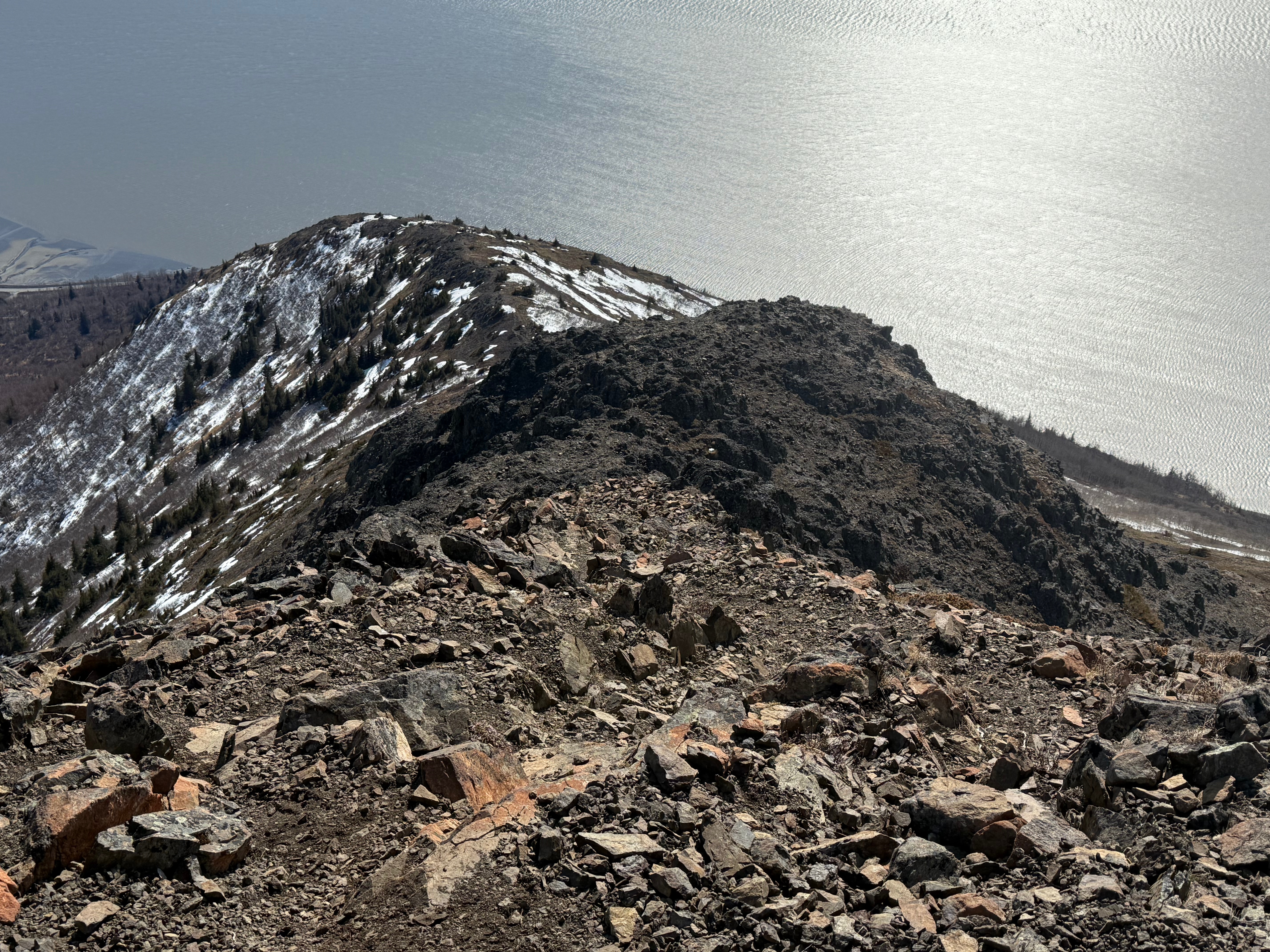 Facing down the rocky slope towards the ocean